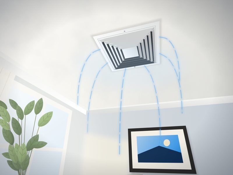 Square white supply register in a living room ceiling with soft lines showing cool air spreading out across the room, daylight from a nearby window