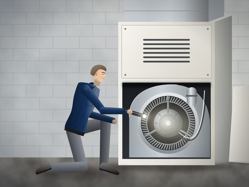 Technician kneeling at an open indoor air handler, shining a flashlight on the blower wheel and motor inside